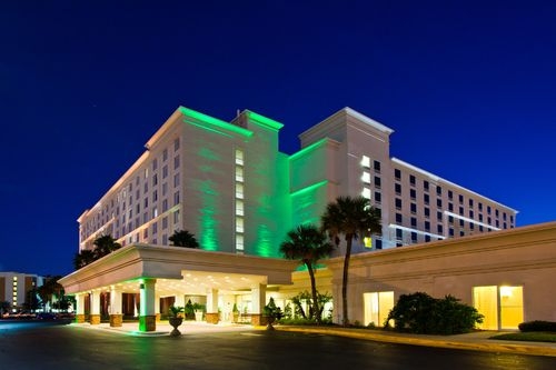 Holiday Inn And Suites Across Universal exterior at night